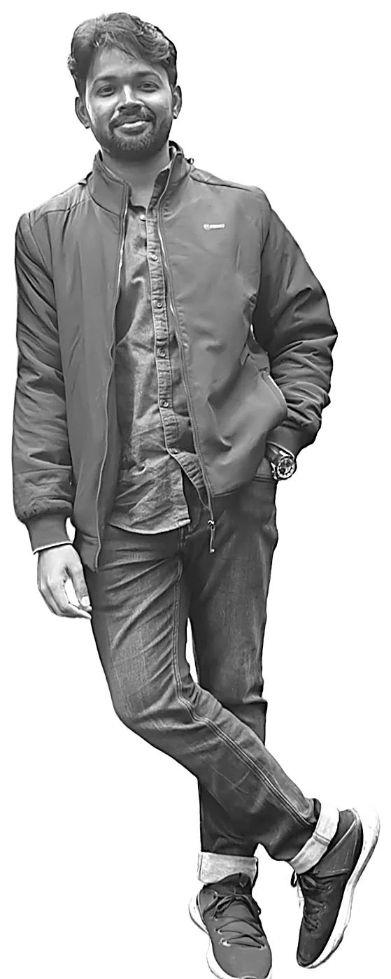 Mukilan, smiling, in a dark jacket and jeans, leaning with one hand in a pocket, printed as black dots